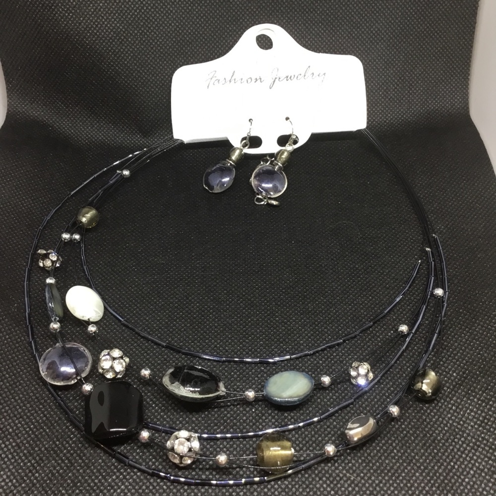 Multilayered necklace with matching earrings.
